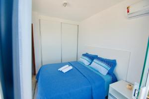 Giường trong phòng chung tại Casa Santorini RJ