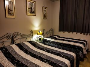 Ένα ή περισσότερα κρεβάτια σε δωμάτιο στο Hotel T Apartment