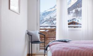 Postel nebo postele na pokoji v ubytování Haus-Ascot-Zermatt