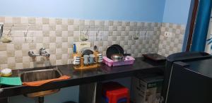 a toy kitchen with a sink and a mixer at DG House in Patnem
