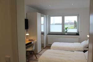 A bed or beds in a room at Gästezimmer Bergerhof - Ankommen und Wohlfühlen