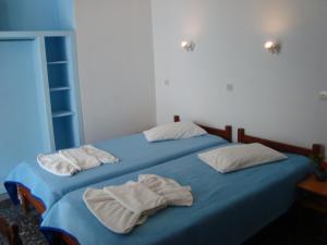 Кровать или кровати в номере Vakhos