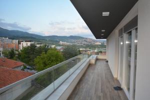 a balcony with a view of a city at Apart Hotel Family in Sarajevo