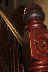 a close up of a wooden stair railing at John St Town House - Self Catering - Guesthouse Style - Great Value Family and Double Rooms in Workington