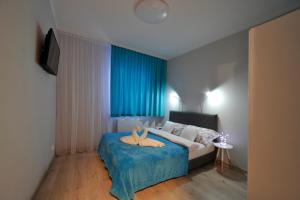Posteľ alebo postele v izbe v ubytovaní Dream Apartment