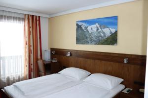 Postel nebo postele na pokoji v ubytování Hotel Rupertihaus