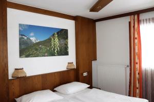 Postel nebo postele na pokoji v ubytování Hotel Rupertihaus
