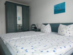 מיטה או מיטות בחדר ב-Landhaus am Haff