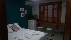 Een bed of bedden in een kamer bij Casa em Santo Antônio de Lisboa