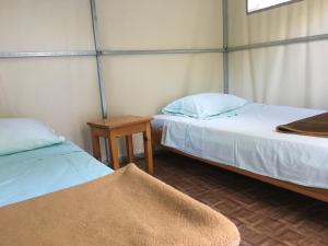 Säng eller sängar i ett rum på Camping Paleokastritsa