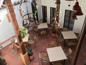 an overhead view of a restaurant with tables and chairs at Hostal La Candelaria in Bogotá