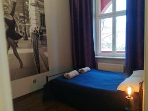 Posteľ alebo postele v izbe v ubytovaní Stylowa Kamienica w Centrum