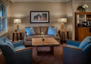 a living room with a couch and two chairs at Sun Valley Resort in Sun Valley