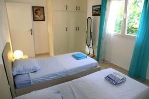 Postel nebo postele na pokoji v ubytování Villa Masline