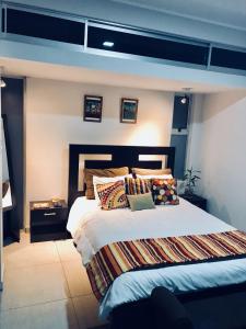 Ένα ή περισσότερα κρεβάτια σε δωμάτιο στο Costa Rica San Jose Full and Comfortable Apartament Pinares Curridabat
