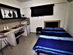 Una cocina o cocineta en Mi Depa Tec 25