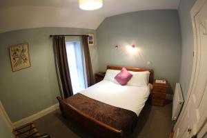 Postel nebo postele na pokoji v ubytování Rolling Wave Guesthouse