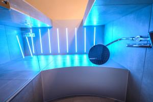 a bathroom with a toilet with a blue light at Dimora Sant'Angelo in Montescaglioso