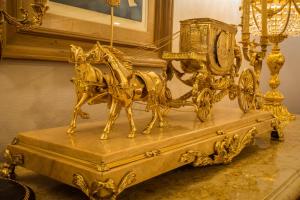 a gold statue of a horse pulling a carriage at Olyver Hotel in Los Angeles