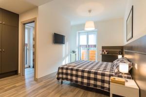 Postel nebo postele na pokoji v ubytování parina Inn – Locanda