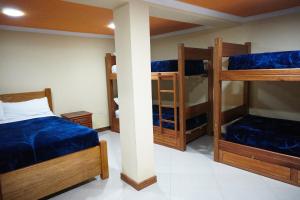 Postel nebo postele na pokoji v ubytování Community Hostel Alausi