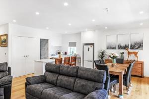 a living room with a couch and a table at Olinda Two Bedroom Apartment - B2 in Olinda