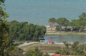 a view of a lake with the ocean in the background at HD GUEST HOUSE KUANTAN in Kuantan