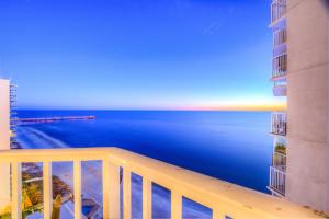 a view of the ocean from a balcony of a condo at Tidewater Beach Resort 1818 By Aneliya in Panama City Beach