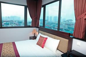 Giường trong phòng chung tại Monaco building 901