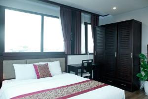 Giường trong phòng chung tại Monaco building 901
