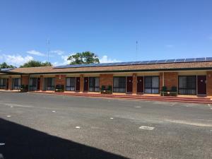 a brick building with a road in front of it at Homestead Motel in Dubbo