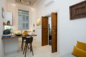 a kitchen with a small table in a room at Marvellous apt near Vatican in Rome