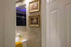 a bathroom with a sink and a mirror at Marvellous apt near Vatican in Rome +32 photos