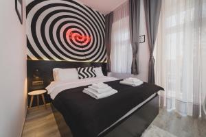Postel nebo postele na pokoji v ubytování Hotel Marienplatz Podgorica