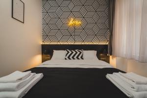 Postel nebo postele na pokoji v ubytování Hotel Marienplatz Podgorica