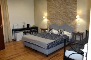 Postel nebo postele na pokoji v ubytování La dolce vita QG