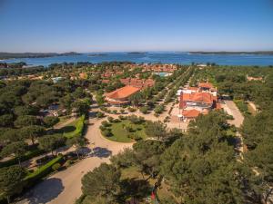 an aerial view of a building with trees and water at Albatross Mobile Homes on Camping Bi Village in Fažana