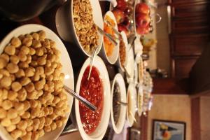 a bunch of plates of food on a wall at Hotel SultanHill in Istanbul