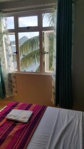 Voodi või voodid majutusasutuse Krishangel Beach Apartment toas