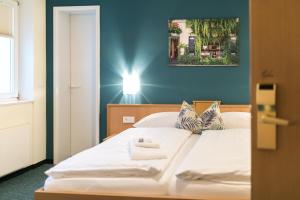 Postel nebo postele na pokoji v ubytování martas Hotel Allegra Berlin