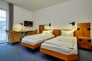 Кровать или кровати в номере Apartment Landhotel Zum Storchennest