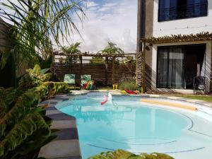 a swimming pool in the backyard of a house at Absolute Castillo in Riebeek-Kasteel