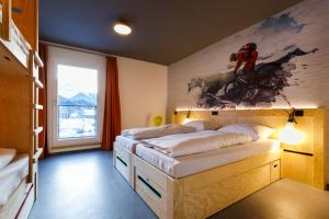 En eller flere senge i et værelse på DJH moun10 Jugendherberge - membership required!