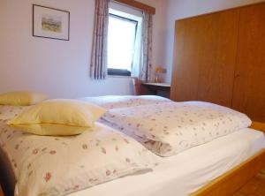 A bed or beds in a room at Apartment Weissenegger
