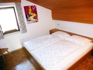 A bed or beds in a room at Apartment Weissenegger