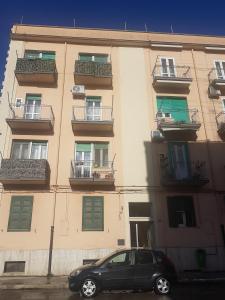 a black car parked in front of a building at Casa Vacanze Derica in Matera