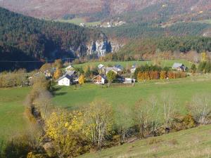 a house in a field in a mountain at Gîte des Gorges du Bruyant in Saint-Nizier-du-Moucherotte