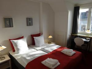 Postel nebo postele na pokoji v ubytování City Hotel Nebo