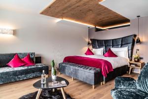 Postel nebo postele na pokoji v ubytování Boutique Hotel Kircher