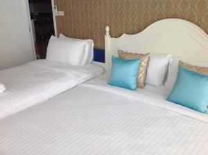 Postel nebo postele na pokoji v ubytování My Resort Huahin C605